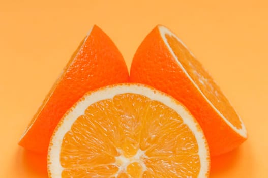 Orange pattern on orange colored background citrus arrangement