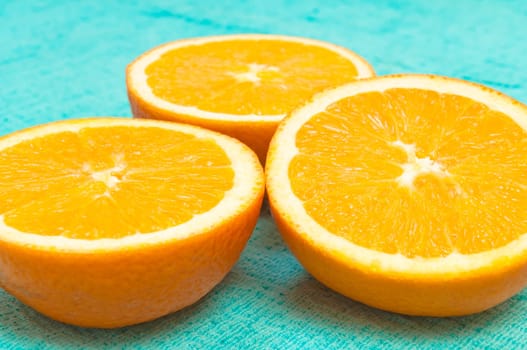 Orange and lemon citrus fruit pattern on light blue background