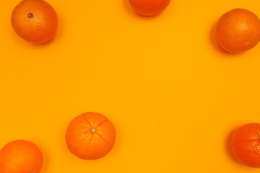 Orange pattern on orange colored background citrus arrangement