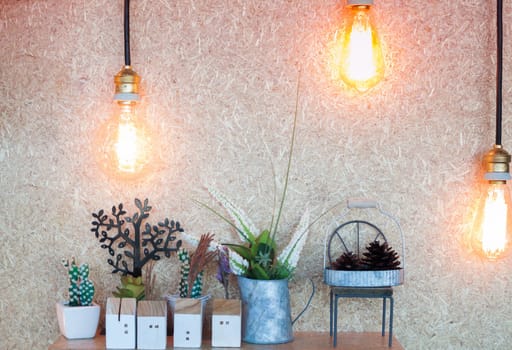Vintage lighting decorated on brown background, stock photo