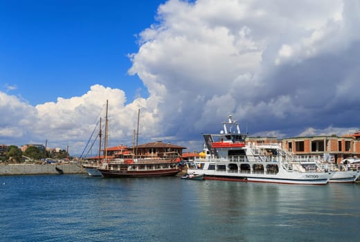 Nesebar, Bulgaria - September 06, 2013: Ships and boats in the port of the old town Nessebar on the bulgarian Black Sea coast. Sunny summer day. UNESCO world heritage site.