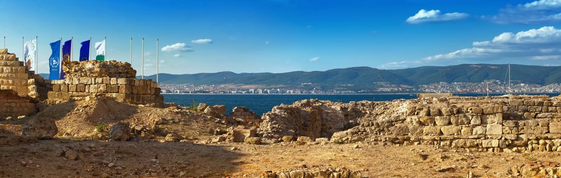 Nesebar, Bulgaria - August 30, 2013: Ancient ruins and the remains of an old fortress wall in the old town of Nessebar, on the Black Sea coast. UNESCO world heritage site. Panoramic shot.