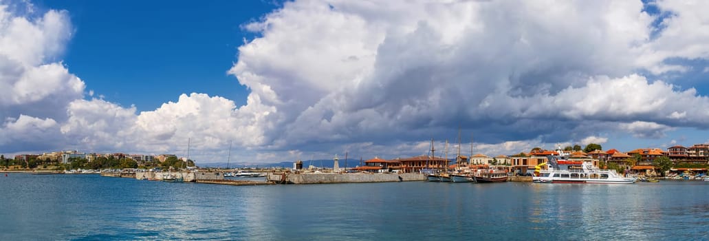 Nesebar, Bulgaria - September 06, 2013: Ships, boats and yachts in the port of the old town Nessebar on the bulgarian Black Sea coast. UNESCO world heritage site. Panoramic shot.