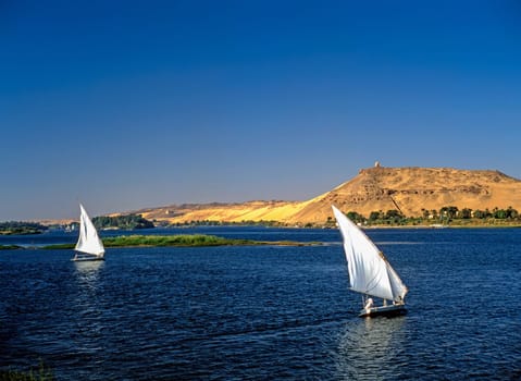 River Nile with feluccas in background monument  to  Aga Khan