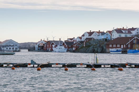 one harbour in sweden on the westcoast a fishingboat and many other boat