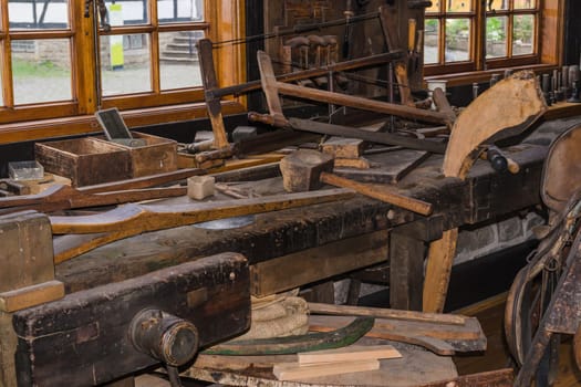 View into a workshop with workbench and tools of a carpenter or carpenter.
