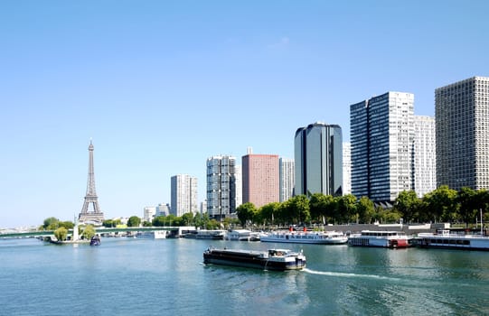 barge on the Seine and Eiffel tower, Paris, France