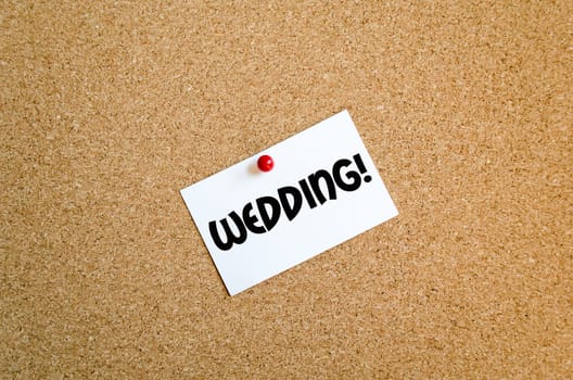 Sticky note on cork board background and text concept