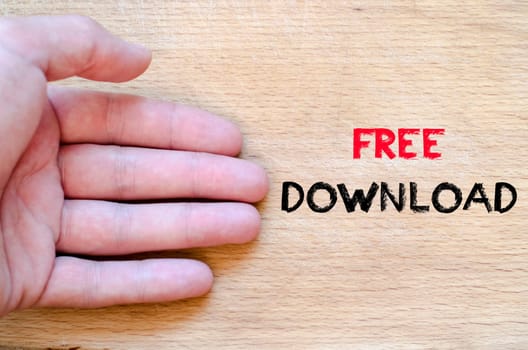 Human hand over wooden background and free download text concept