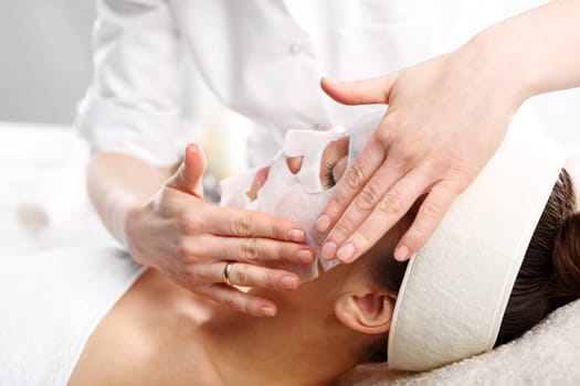 cosmetic cabinet,natural cosmetics. natural spa,a woman in a collagen mask