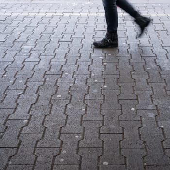 Legs of a woman on the platform with motion blur