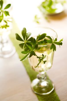 Maibowle with woodruff on a bright background