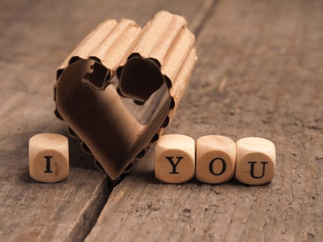 Love concept image with a cardboard heart shape using as background or greeting card