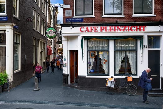 AMSTERDAM, NETHERLANDS - JULY 7, 2016: Typical street iand traditional cafe near Oostelijk Havengebied  - special neighbourhood is full with vintage and designer shopping, speciality stores and cozy cafes, Amsterdam.