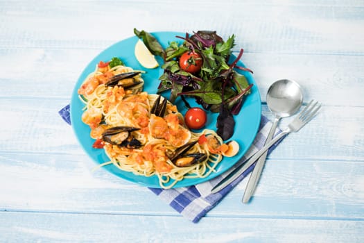 spaghetti frutti di mare,fresh spinach.