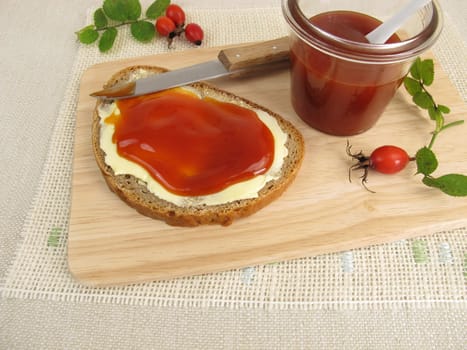 A slice of bread with rosehip jam for breakfast