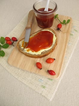 A slice of bread with rosehip jam for breakfast