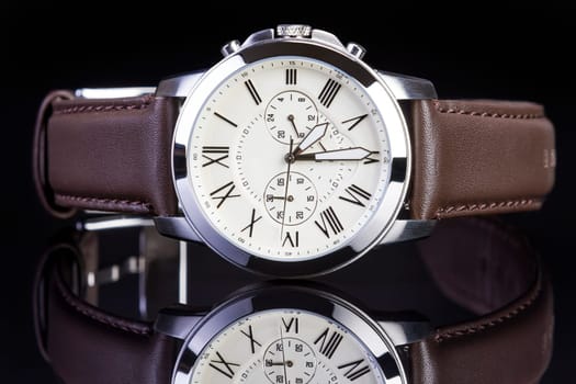 Men's luxury wrist watch on white background.