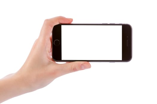 Hand holding black smart phone isolated on white clipping path inside