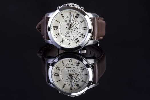 Men's luxury wrist watch on white background.