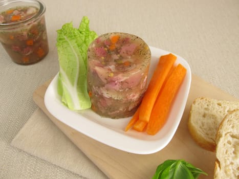 Homemade Sülze with salad and rolls