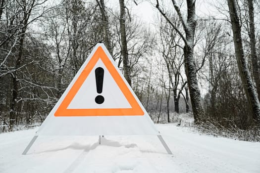 Sign with exclamation mark in the forest