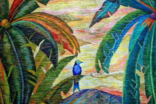 A design with a bird and palm trees
