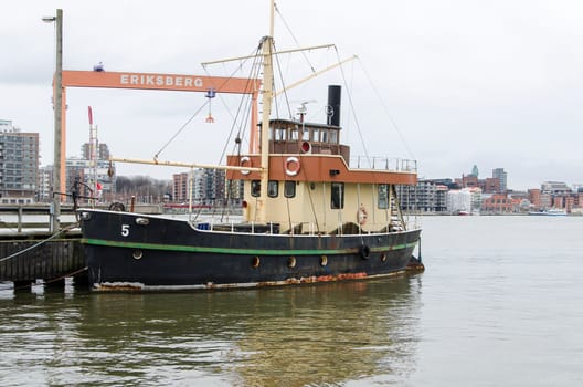 one old boat on the pier in the harbour in Gothenburg