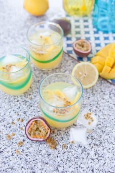 Colourful cocktail with passion fruit and mango