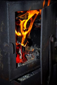Burning fire wood in the brick furnace