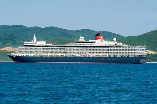 A large cruise ship enters the port