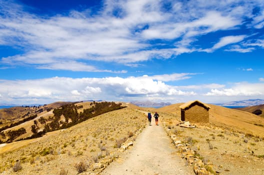 Backpackers on a trail on the Island of the Sun in Bolivia