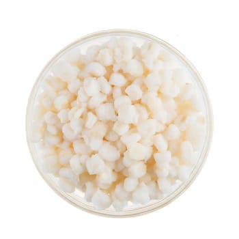Isolated bowl of white raw hominy