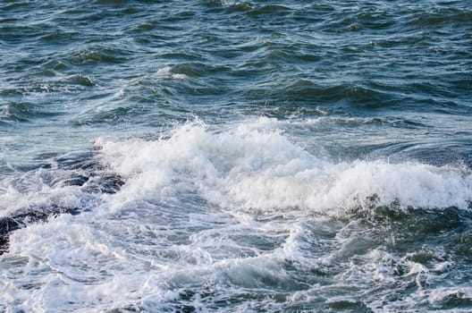 the water spash to the rock and begins to be foam