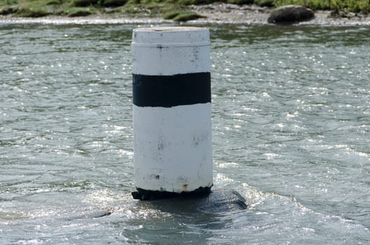 one navigation mark in the water to help to drive the boat safe