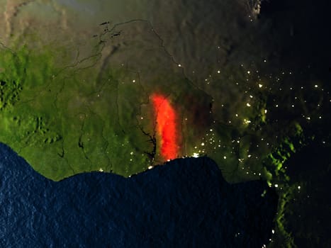 Togo in red at night as seen from Earth's orbit in space. 3D illustration with highly detailed realistic planet surface. Elements of this image furnished by NASA.
