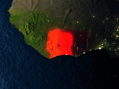 Ivory Coast in red at night as seen from Earth's orbit in space. 3D illustration with highly detailed realistic planet surface. Elements of this image furnished by NASA.