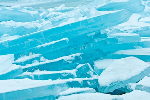 Winter scene at a frozen lake with ice-pack and other ice formations