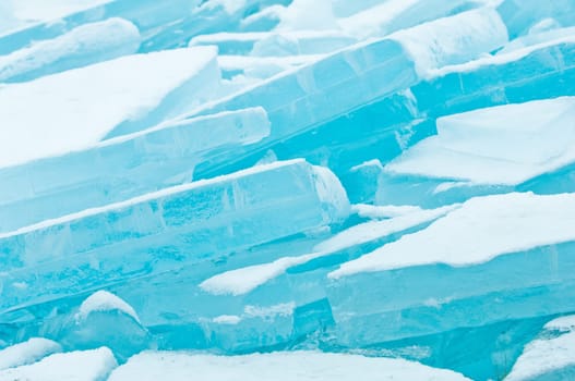 Winter scene at a frozen lake with ice-pack and other ice formations
