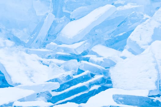 Winter scene at a frozen lake with ice-pack and other ice formations