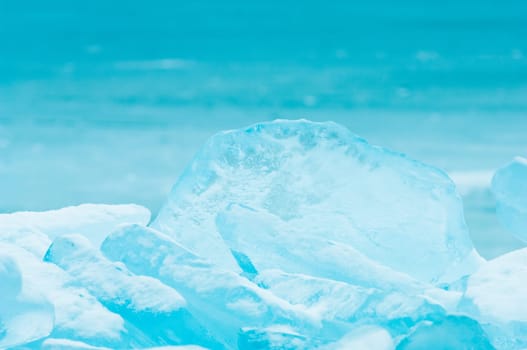 Winter scene at a frozen lake with ice-pack and other ice formations