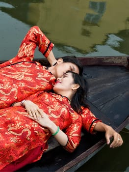 Hoi An, Vietnam - Dec 28, 2016: Wedding photo shoot on the Thu Bon river. Its beauty and charm makes it popular with photographers.
