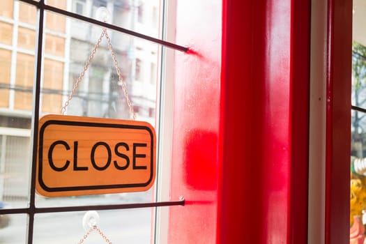 Vintage looking closed sign in the shop, stock photo
