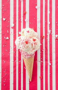 Vanilla ice cream in waffle tug with sugar sprinkles