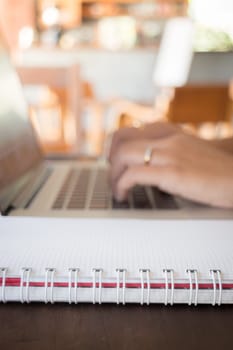 Opened laptop on wooden work table, stock photo