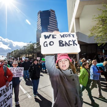TUCSON, AZ - JANUARY 21: Woman holding immigrant rights sign during the Women's March on Washington protest against Donald Trump on January 21, 2017 in Tucson, AZ, USA..