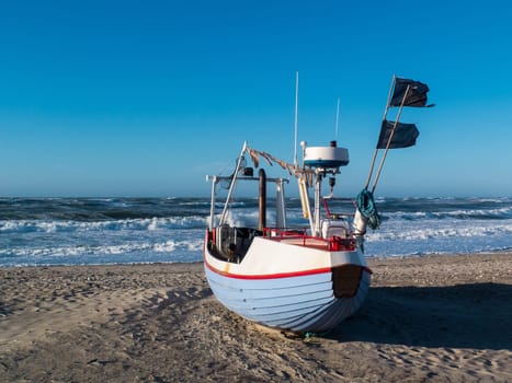 Fishing village with the old wooden fishing boats pulled up on the beach