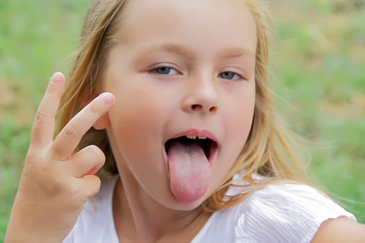 Portrait of girl with smile and makes faces