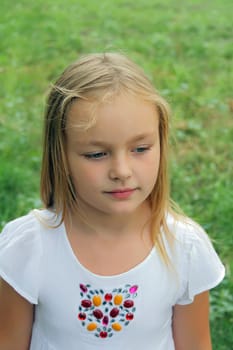 Portrait of younger schoolgirl with blond hair