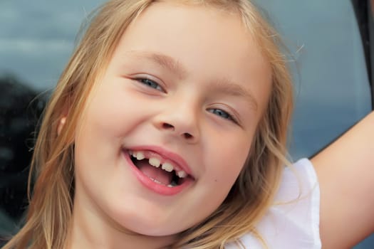 Portrait of girl with smile and open mouth